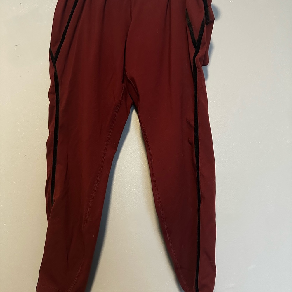 Woman’s maroon leggings with Black Trim